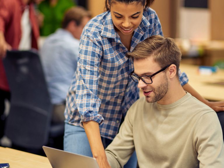 mentoring-in-office-two-young-multiracial-colleag-2022-02-04-19-15-33-utc-1-1.jpg